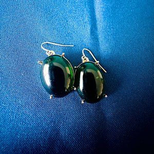 Fashion gold Trimmed earrings w/ an oval emerald green stone